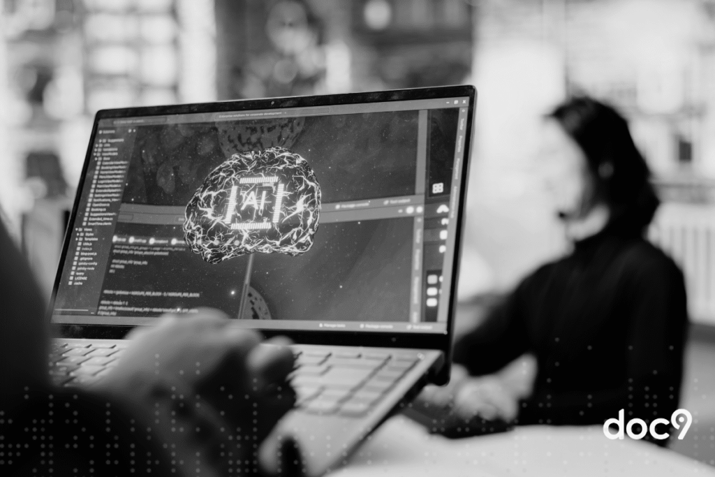 Notebook aberto com uma mão apoiada sobre o teclado, e na tela, a imagem de um cérebro de inteligência artificial, representando a ética da IA jurídica.